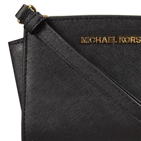 michael kors mini purse with metal plate with est 1967|Michael Kors mini crossbody purse.